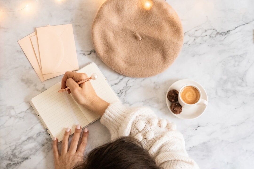 person brainstorming blog ideas on notebook