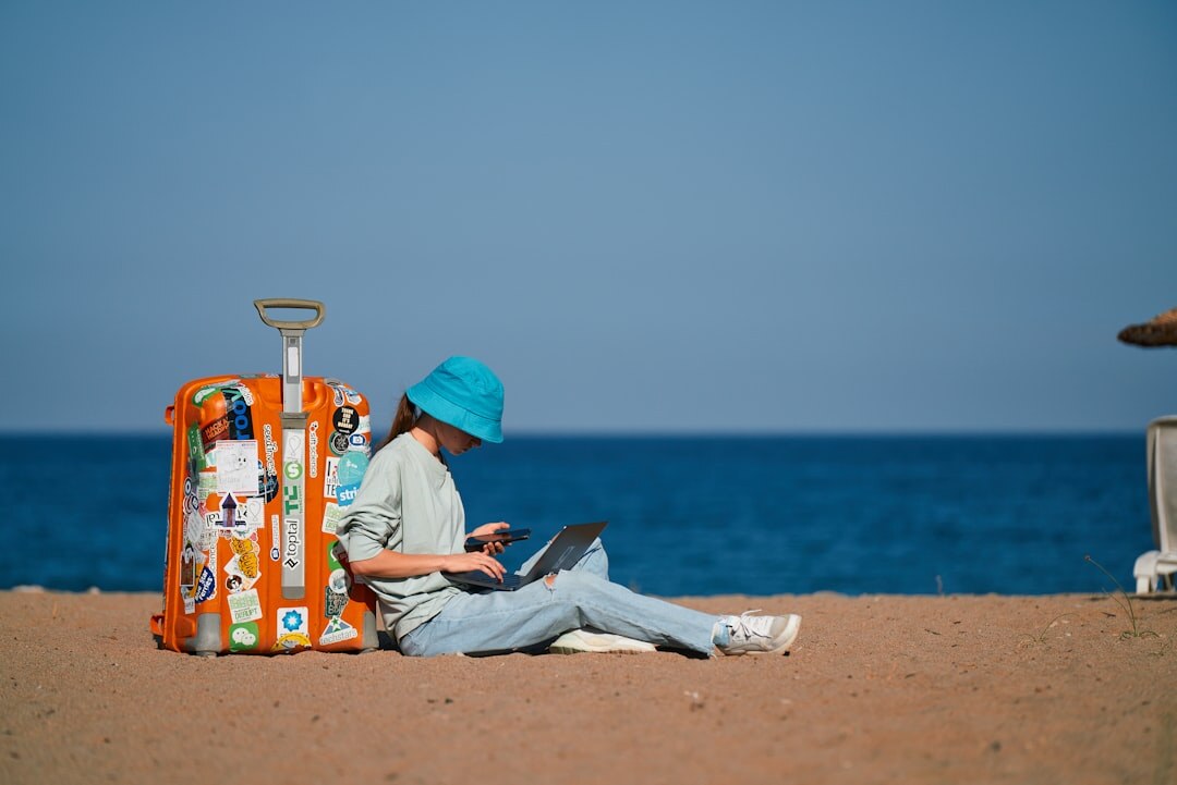 person coding on laptop