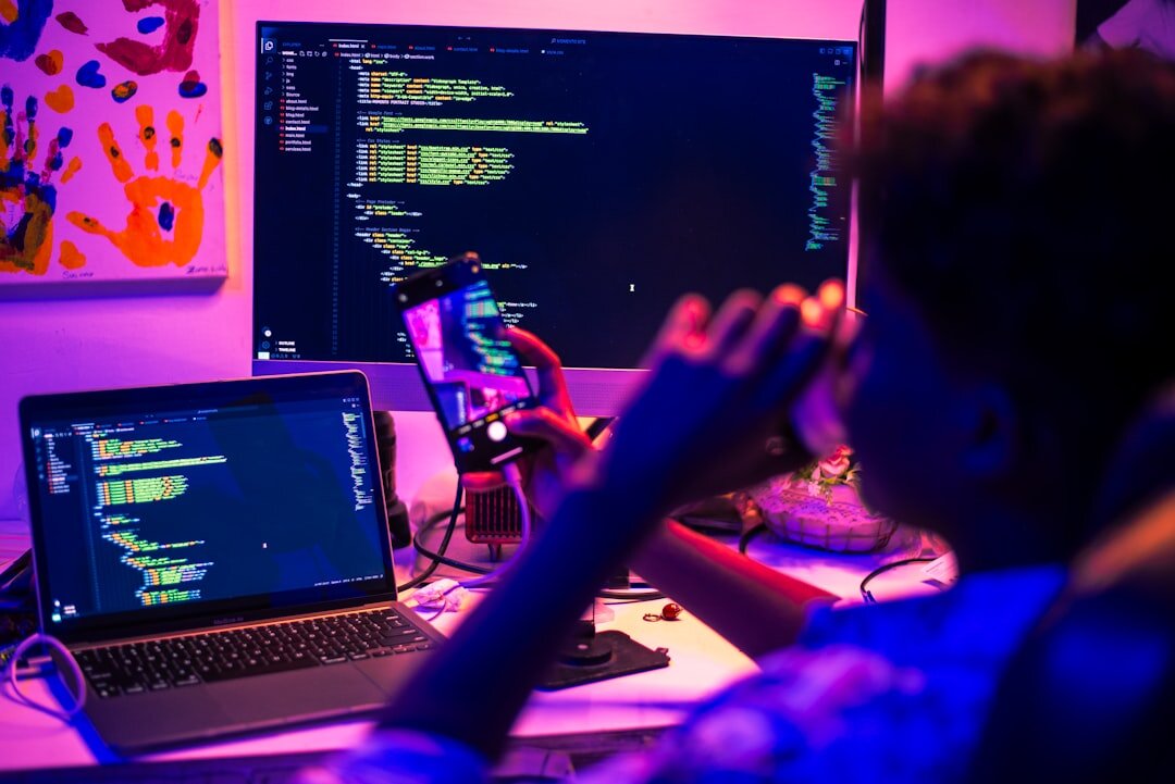 person coding on laptop