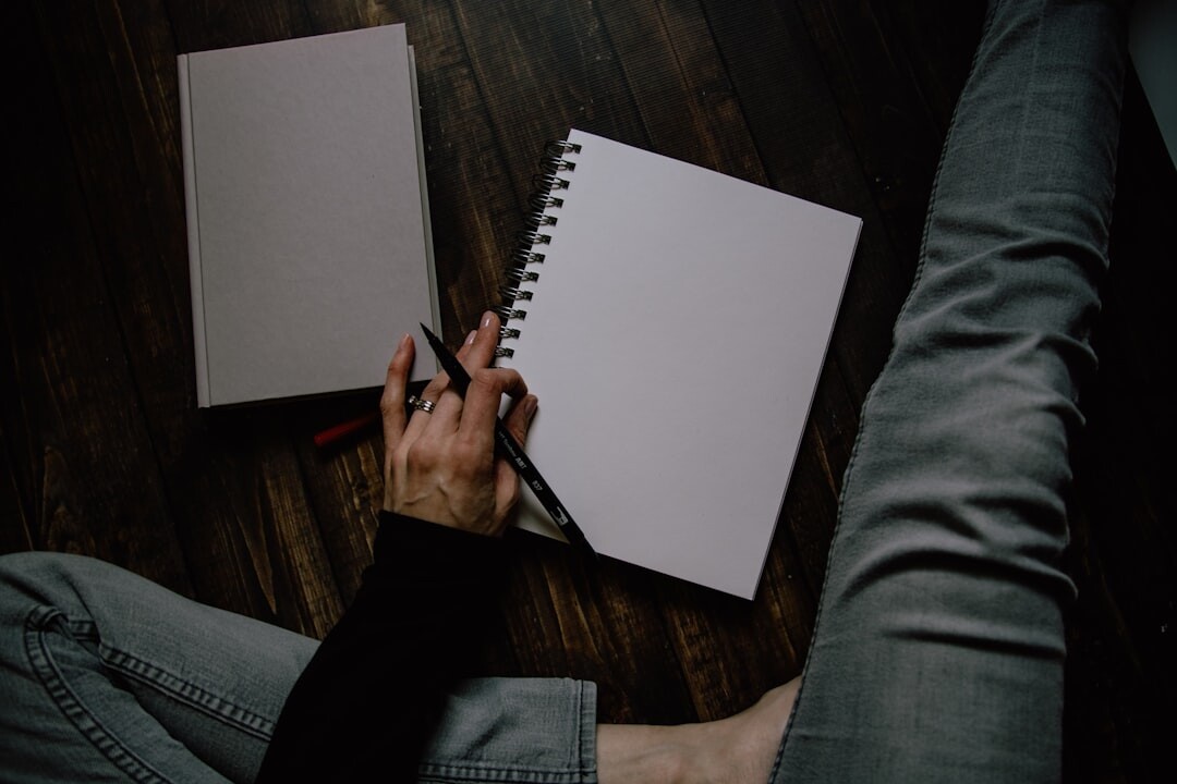 person brainstorming blog ideas on notebook